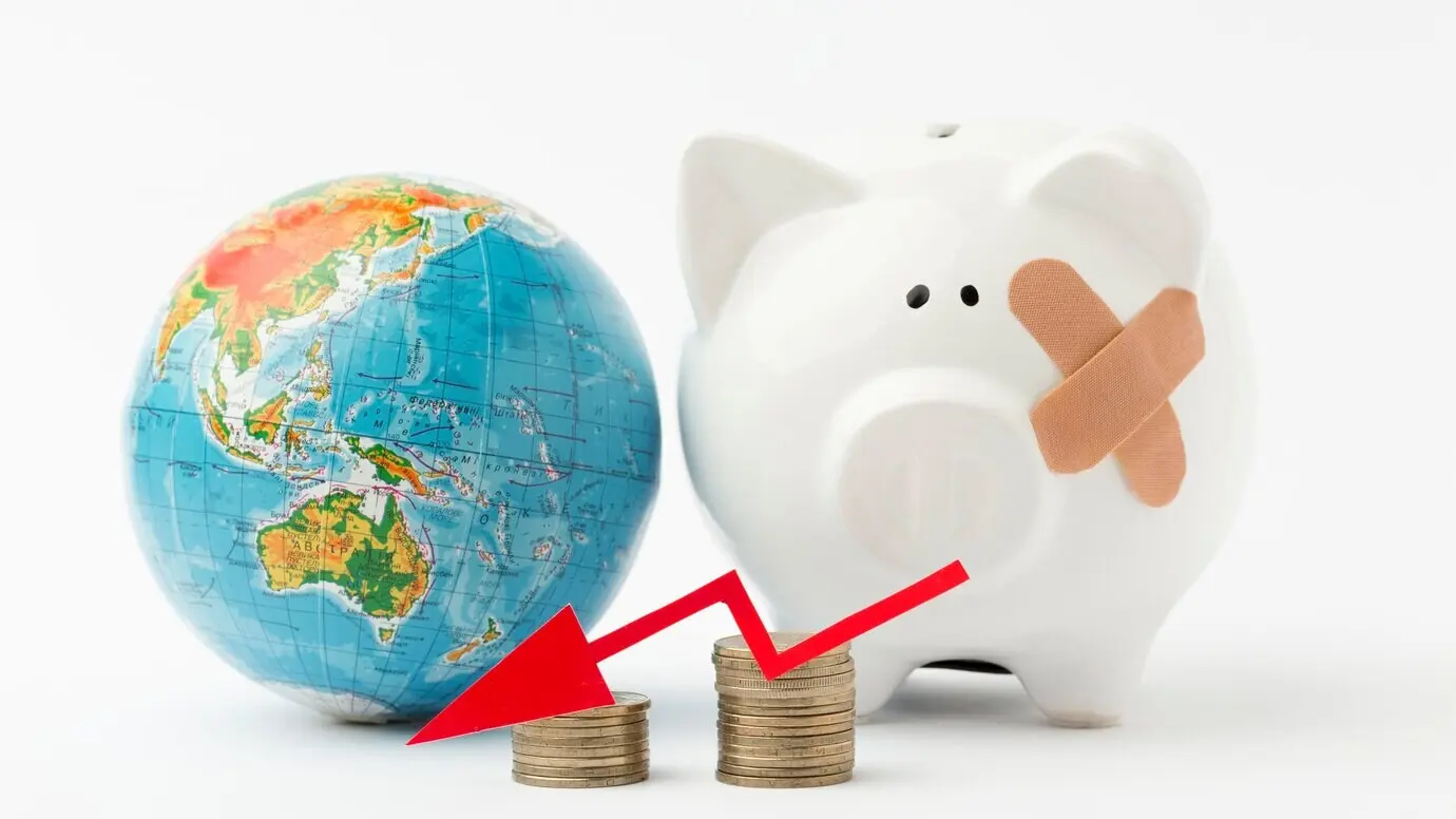 A broken piggy bank and global recession
